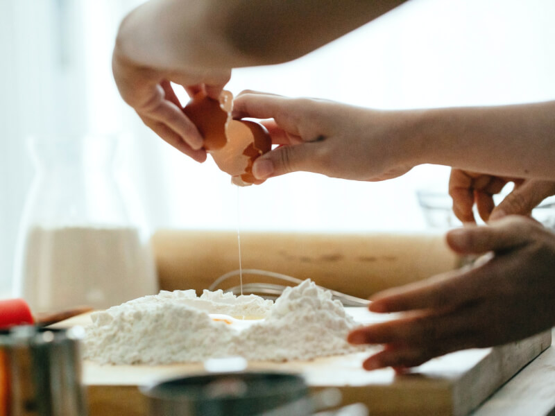 A couple tries pasta making at home.